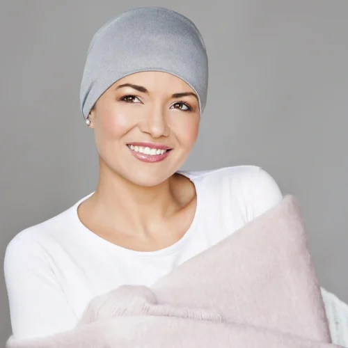 woman wearing grey sleep hat chemo
