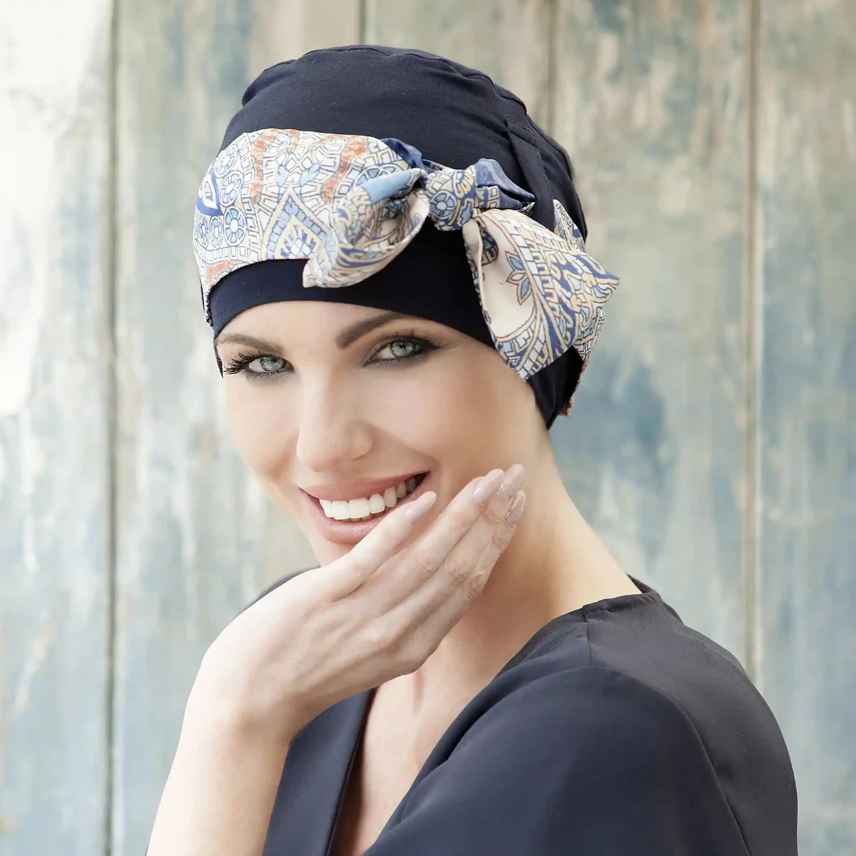 Woman wearing Yanna chemo headwear colour Navy Mosaica Linea