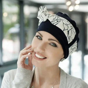Woman wearing Yanna chemo headwear colour Navy White Lilium