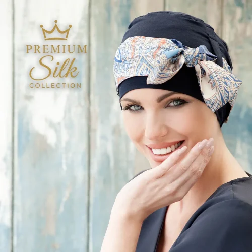 A Woman Wearing Yanna Silk Navy Mosaica Linea Chemo Headwear Paired with an Ultra-Soft Silk Scarf