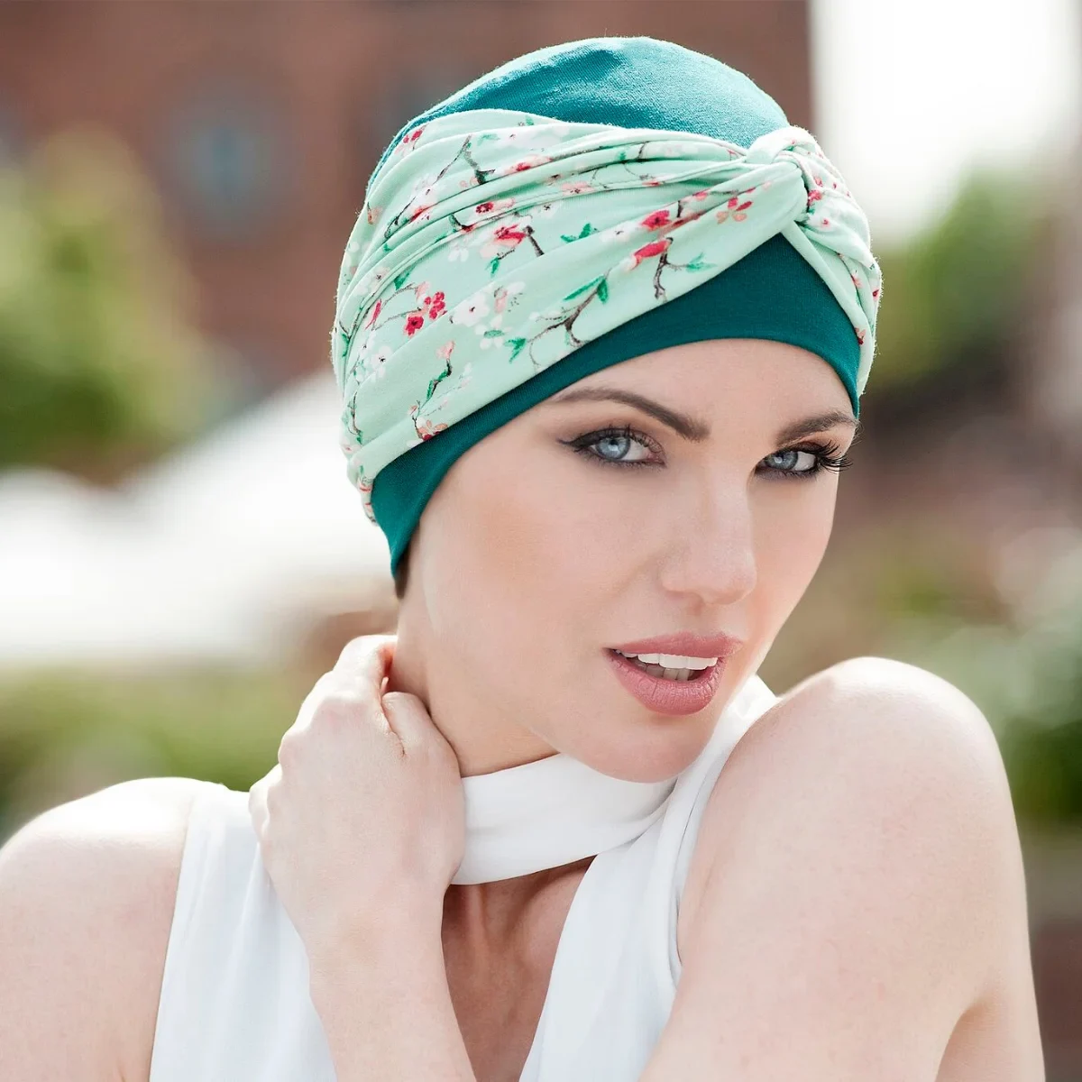 A Woman Wearing Ella Chemo Turban in Green Forest Flower